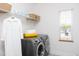 This laundry room has modern washer/dryer and useful shelving at 638 Boulder Point Dr, Chapel Hill, NC 27516