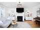 Cozy living room with fireplace, hardwood floors, and natural light at 638 Boulder Point Dr, Chapel Hill, NC 27516