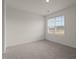 This bedroom features a large window that fills the space with natural light at 704 Shepard Rock Dr, Zebulon, NC 27597