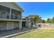 Expansive backyard features a fire pit, stone patio, well-kept lawn, and screened in porches at 754 Epps Clark Rd, Siler City, NC 27344