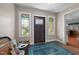 Welcoming entryway featuring stained glass windows, blue tile, and hardwood flooring at 754 Epps Clark Rd, Siler City, NC 27344