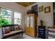 Charming foyer features lots of natural light, unique furniture, and neutral-toned decor for a warm and welcoming entrance at 754 Epps Clark Rd, Siler City, NC 27344