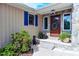 Inviting front entrance featuring a stone facade, colorful shutters and a charming wreath at 754 Epps Clark Rd, Siler City, NC 27344