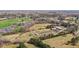 Expansive aerial view of a farm property featuring vast fields, a pond, and multiple structures at 754 Epps Clark Rd, Siler City, NC 27344