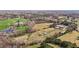 Expansive aerial view of a farm property featuring vast fields, a pond, and multiple structures at 754 Epps Clark Rd, Siler City, NC 27344