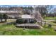 Aerial view of a home, showcasing the deck, landscaping, and surrounding greenery of the property at 754 Epps Clark Rd, Siler City, NC 27344