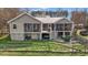 Exterior backyard view with a stone patio, screened-in porch, and outdoor entertaining space at 754 Epps Clark Rd, Siler City, NC 27344