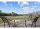Expansive backyard view from the wooden deck, showcasing the serene surroundings and tranquil setting at 754 Epps Clark Rd, Siler City, NC 27344