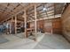 Interior of barn features wood beams, stalls, and concrete floors at 754 Epps Clark Rd, Siler City, NC 27344