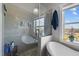 Bright bathroom with glass shower and soaking tub at 754 Epps Clark Rd, Siler City, NC 27344
