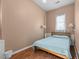 Cozy bedroom featuring wood floors, neutral walls, and a comfortable bed with a light blue comforter at 754 Epps Clark Rd, Siler City, NC 27344