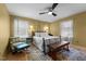 Cozy bedroom featuring stylish wallpaper and plush seating at 754 Epps Clark Rd, Siler City, NC 27344