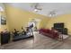 Spacious bonus room with multiple ceiling fans, a comfortable sofa, and recreational equipment at 754 Epps Clark Rd, Siler City, NC 27344