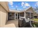 Exterior view of a covered deck with a barbecue grill and outdoor dining area at 754 Epps Clark Rd, Siler City, NC 27344