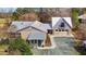 Exterior of home, showing a well-manicured lawn, stone accents, metal roof and driveway at 754 Epps Clark Rd, Siler City, NC 27344