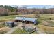 Horse barn with multiple stalls and fenced pasture at 754 Epps Clark Rd, Siler City, NC 27344