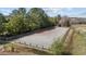 Fenced horse training ring featuring well-maintained dirt and secure perimeter fencing at 754 Epps Clark Rd, Siler City, NC 27344