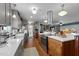 Bright and airy kitchen featuring custom cabinets, stainless steel appliances and hardwood floors at 754 Epps Clark Rd, Siler City, NC 27344