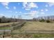 Pastoral landscape with fencing and mature trees at 754 Epps Clark Rd, Siler City, NC 27344