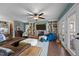 Spacious living room with built-in bookshelves, a brick fireplace, and comfortable seating at 754 Epps Clark Rd, Siler City, NC 27344