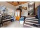 Mudroom with tile flooring, storage cabinet, and steps leading to the main living area at 754 Epps Clark Rd, Siler City, NC 27344