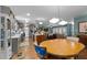 Open concept kitchen, dining, and living areas with hardwood floors and stainless steel appliances at 754 Epps Clark Rd, Siler City, NC 27344