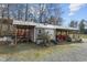 Well-equipped outbuilding with metal roof and multiple storage bays for tractors and other equipment at 754 Epps Clark Rd, Siler City, NC 27344