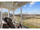 Relaxing screened-in porch with comfortable seating and tranquil pasture views at 754 Epps Clark Rd, Siler City, NC 27344