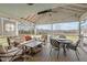 Inviting screened porch with comfortable seating and outdoor dining area at 754 Epps Clark Rd, Siler City, NC 27344