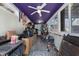 Spacious storage room with purple ceiling for equestrian equipment and supplies at 754 Epps Clark Rd, Siler City, NC 27344