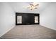 Comfortable bedroom featuring a ceiling fan and two windows for ample natural light at 8300 Neuse Hunter Dr, Raleigh, NC 27616