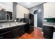 Bright kitchen with stainless steel sink, gray countertops, and wood flooring at 8300 Neuse Hunter Dr, Raleigh, NC 27616