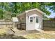 Shed with greenhouse attachment and wooden access ramp with a light-colored exterior paint at 8300 Neuse Hunter Dr, Raleigh, NC 27616