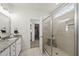Bathroom featuring a glass-enclosed shower, granite vanity, and tile flooring at 86 Buckhaven Ct, Holly Springs, NC 27540