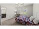 Cozy bedroom with ceiling fan and adjacent bathroom at 86 Buckhaven Ct, Holly Springs, NC 27540