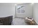 Bright bedroom with plush carpet, an armchair, natural light streaming in through the window at 86 Buckhaven Ct, Holly Springs, NC 27540