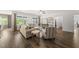 Spacious living room boasts hardwood floors, bright windows, and stylish furniture at 86 Buckhaven Ct, Holly Springs, NC 27540
