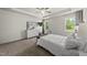 Inviting bedroom with neutral tones, large windows, and ample natural light at 86 Buckhaven Ct, Holly Springs, NC 27540