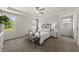 Comfortable main bedroom with tray ceiling, carpet, and natural light at 86 Buckhaven Ct, Holly Springs, NC 27540