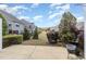 Nice backyard view from patio with a common grassy area surrounded by shrubs and other homes at 9207 Wooden Rd, Raleigh, NC 27617