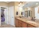 Bathroom with double sink vanity, granite countertops, and tiled shower stall at 9207 Wooden Rd, Raleigh, NC 27617
