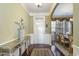 Inviting entryway with elegant decor, wood floors, and view into the dining area at 9207 Wooden Rd, Raleigh, NC 27617