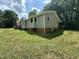 Charming cottage-style home features large windows and a side porch at 10017 Oakley Rd, Zebulon, NC 27597