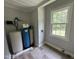 This utility room contains a water filtration system and a window providing natural light at 10017 Oakley Rd, Zebulon, NC 27597