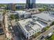 A dynamic aerial view showcasing the vibrant city buildings and surrounding neighborhood, highlighting the location at 101 Morris St # D, Durham, NC 27701