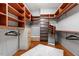 Spacious walk-in closet with custom shelving and hardwood floors at 101 Morris St # D, Durham, NC 27701
