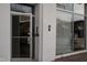 A close-up of a building entrance with glass doors and windows, showing signage at 101 Morris St # D, Durham, NC 27701