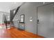 Inviting entryway features hardwood floors, sleek stairs, and modern decor at 101 Morris St # D, Durham, NC 27701