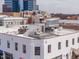 Rooftop view showing building and a rooftop deck with outdoor furniture at 101 Morris St # D, Durham, NC 27701