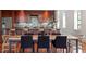 Modern kitchen and dining area features a large island, updated appliances, and hardwood floors at 101 Morris St # D, Durham, NC 27701